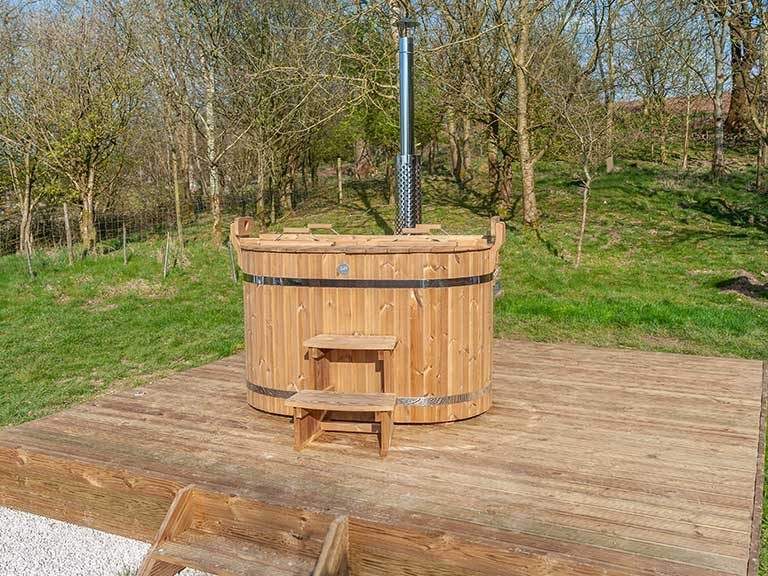 The wood-fired hot tub, which overlooks the stunning landscape around the Kelker Well glamping roundhouse